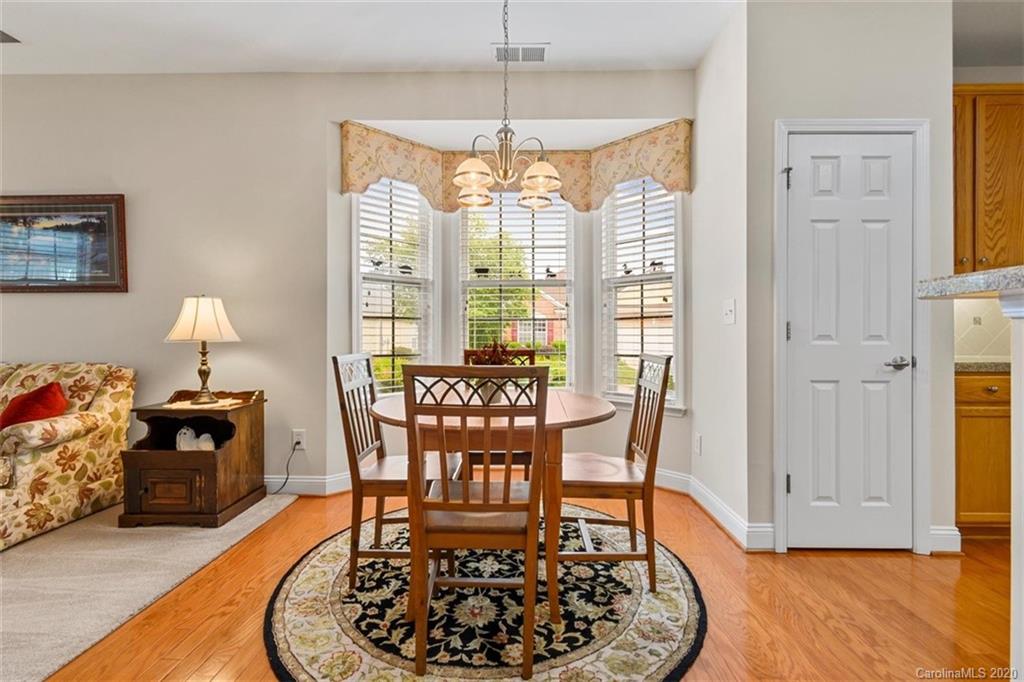 2006 Citron Avenue Fort Mill, SC 29708 - Photo 8 of 35 a dining room with furniture a chandelier and wooden floor