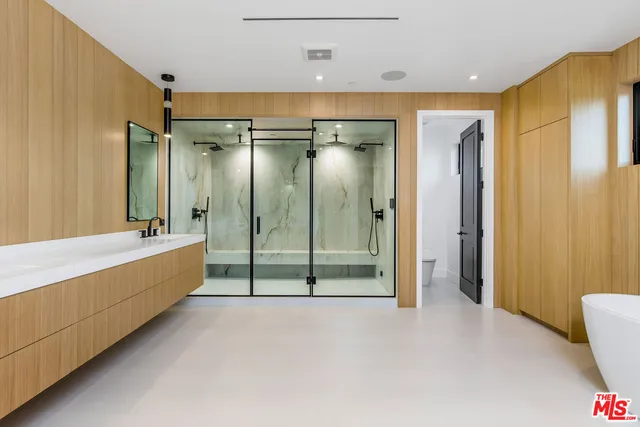 a bathroom with a tub and shower