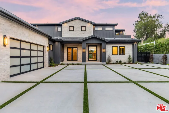 a front view of a building with a garage