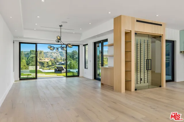 a view of room with window and wooden floor