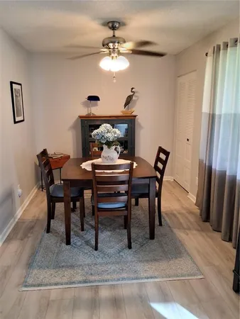 a dining room with furniture and window
