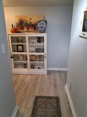 a view of a hallway with shelf