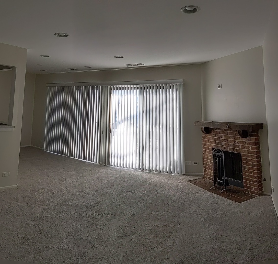 70 Margate Court, Unit C2 Schaumburg, IL 60193 - Photo 14 of 35 a view of empty room with a fireplace