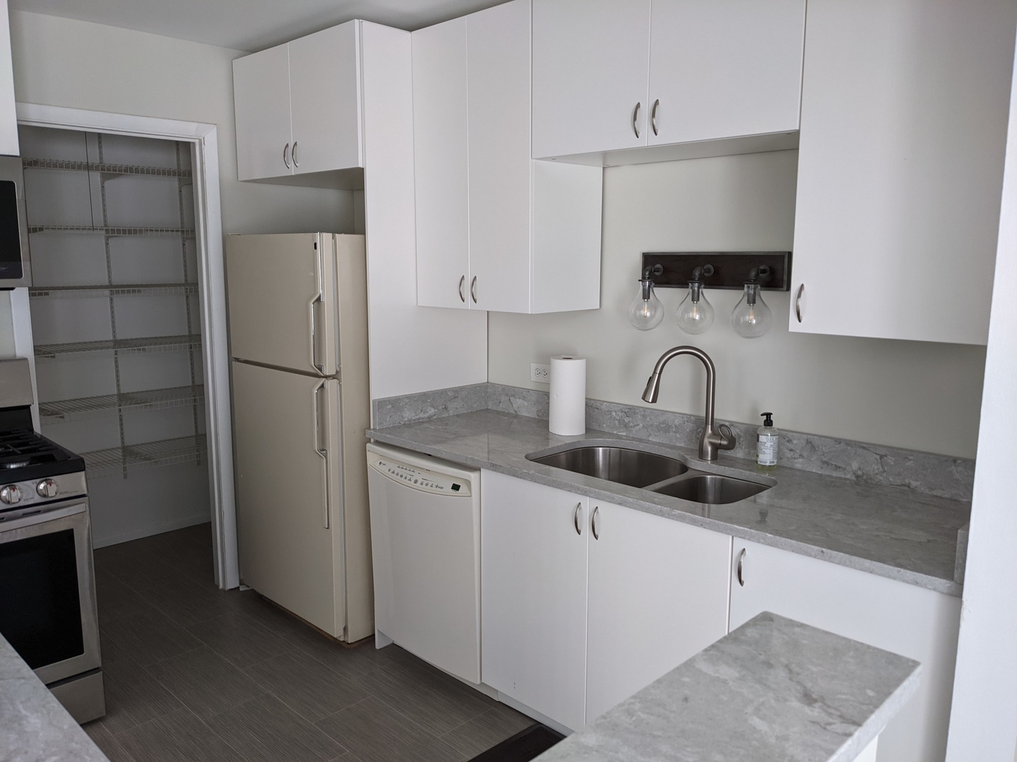 70 Margate Court, Unit C2 Schaumburg, IL 60193 - Photo 17 of 35 a kitchen with stainless steel appliances a refrigerator sink and cabinets