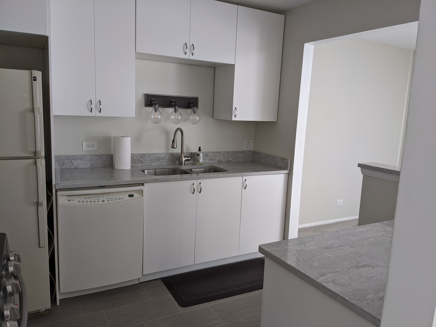 70 Margate Court, Unit C2 Schaumburg, IL 60193 - Photo 19 of 35 a kitchen with stainless steel appliances granite countertop a sink a refrigerator and a granite counter tops