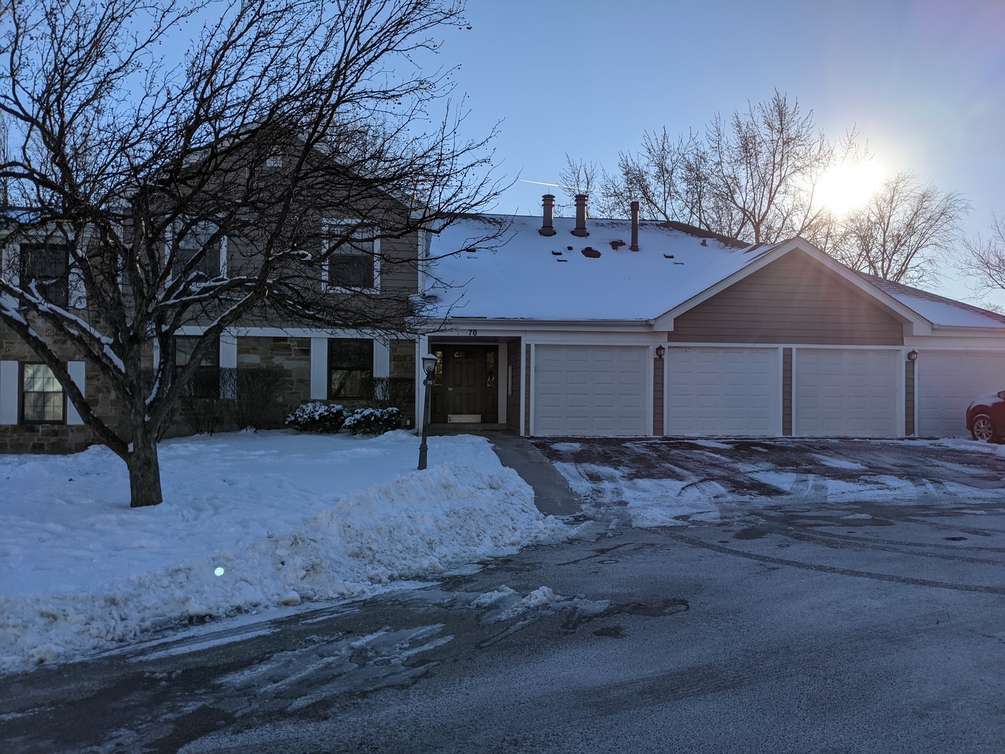 70 Margate Court, Unit C2 Schaumburg, IL 60193 - Photo 3 of 35 a front view of a house with a yard and garage