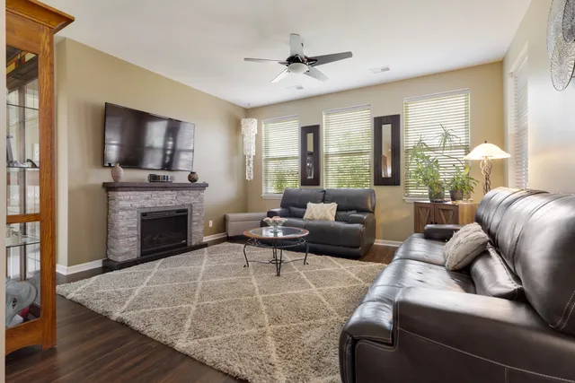 a living room with furniture and a fireplace