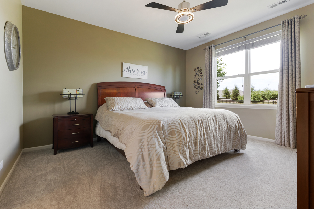 1150 Americana Avenue Pingree Grove, IL 60140 - Photo 12 of 30 a bedroom with a bed and window