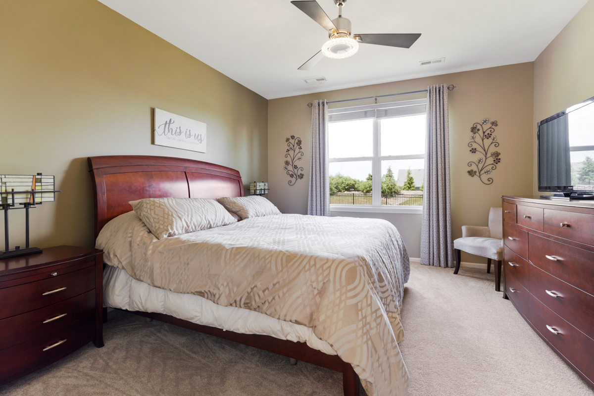 1150 Americana Avenue Pingree Grove, IL 60140 - Photo 13 of 30 a bedroom with a bed and a window