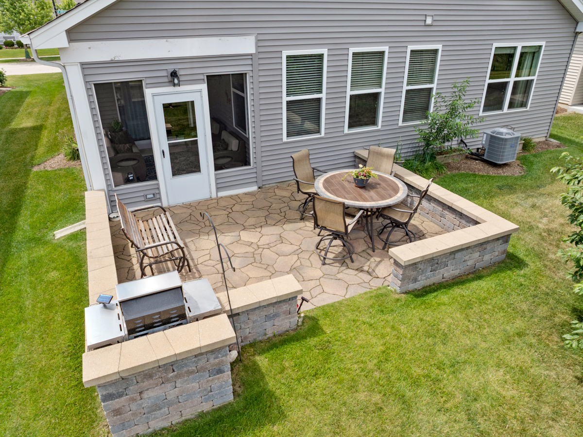 1150 Americana Avenue Pingree Grove, IL 60140 - Photo 24 of 30 a view of a backyard with table and chairs and a barbeque