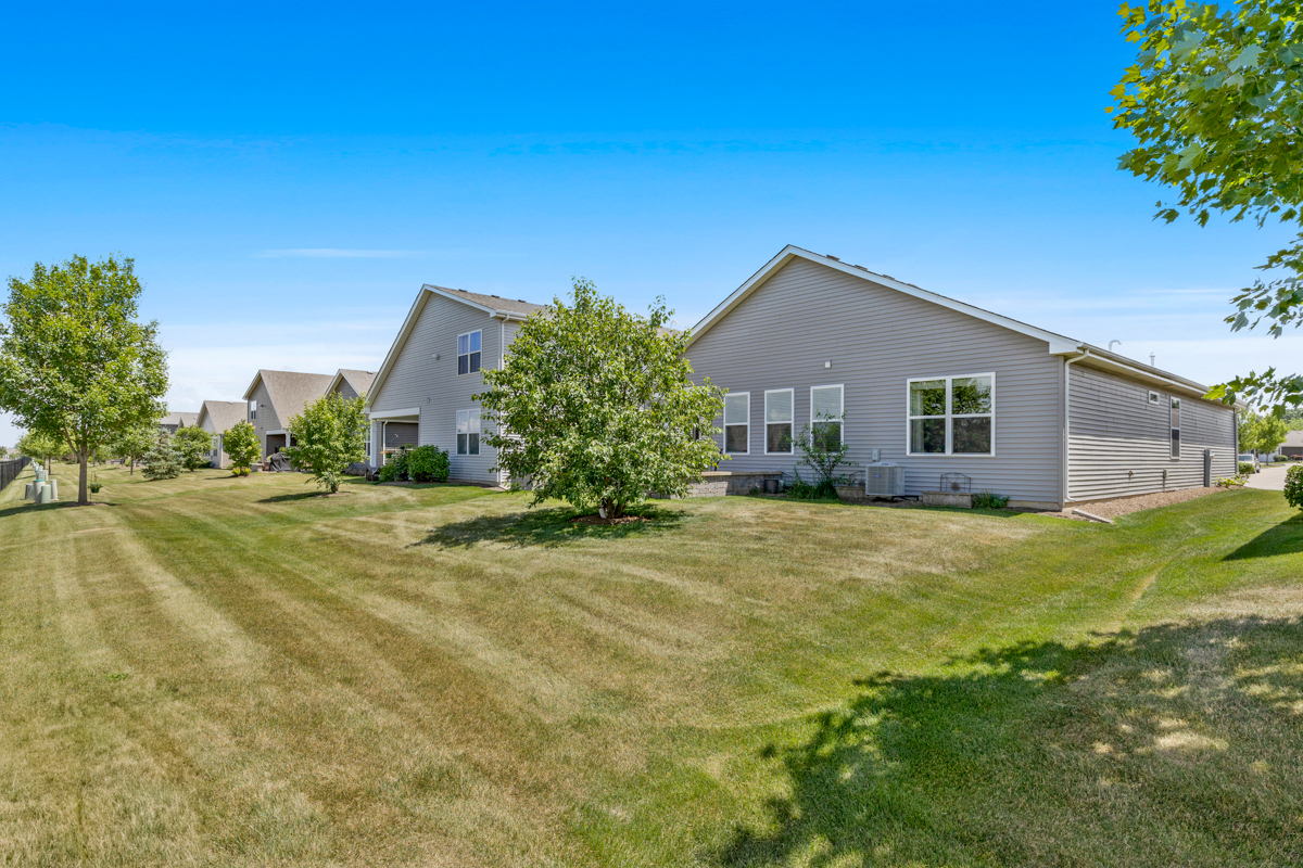 1150 Americana Avenue Pingree Grove, IL 60140 - Photo 27 of 30 a front view of house with yard and trees in the background