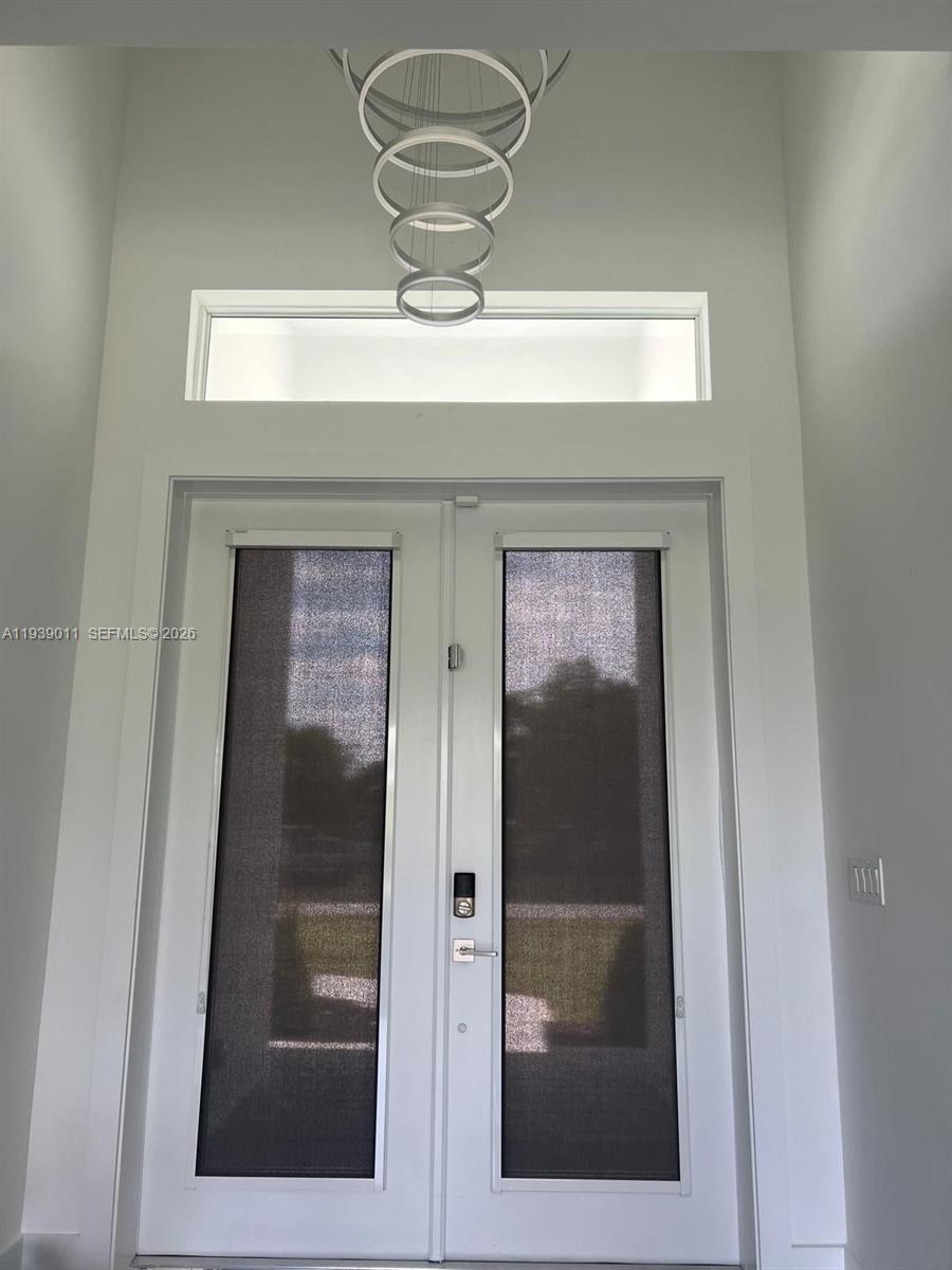 11 Connecticut Road Lehigh Acres, FL 33936 - Photo 2 of 11 a view of a hallway with a mirror