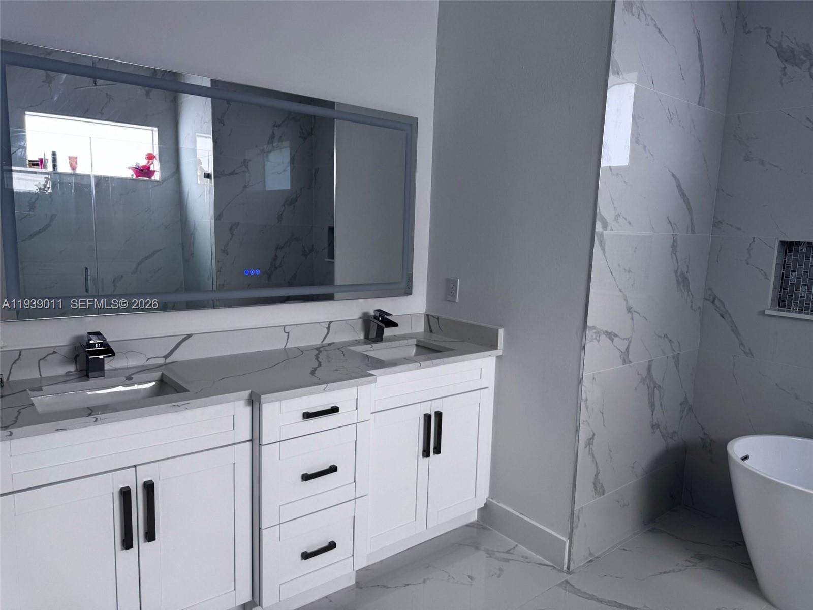 11 Connecticut Road Lehigh Acres, FL 33936 - Photo 6 of 11 a bathroom with a sink and a toilet