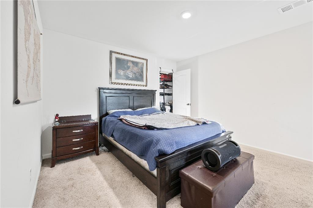 7545 Rambling Vale Dawsonville, GA 30534 - Photo 19 of 46 a bedroom with a bed and a closet