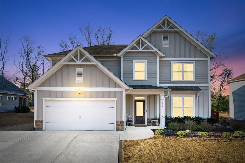 7545 Rambling Vale Dawsonville, GA 30534 - Photo 2 of 46 a front view of a house with garden