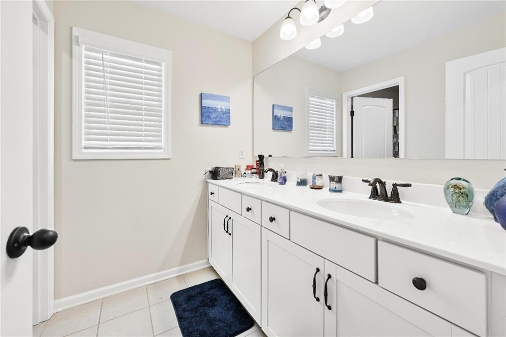 7545 Rambling Vale Dawsonville, GA 30534 - Photo 22 of 46 a bathroom with a sink and a mirror