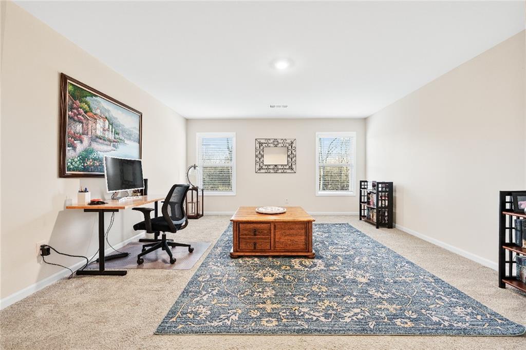 7545 Rambling Vale Dawsonville, GA 30534 - Photo 26 of 46 a living room with furniture and a rug