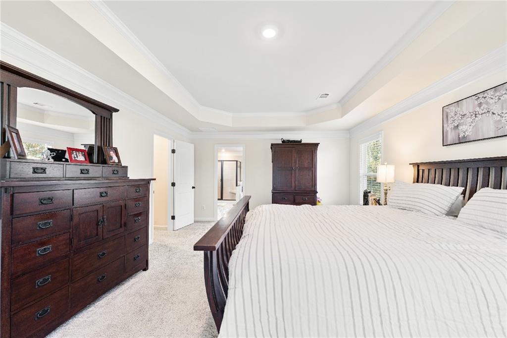 7545 Rambling Vale Dawsonville, GA 30534 - Photo 29 of 46 a bedroom with a bed and a dresser