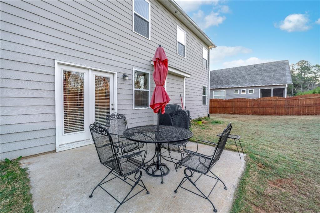 7545 Rambling Vale Dawsonville, GA 30534 - Photo 32 of 46 a view of a house with backyard and sitting area