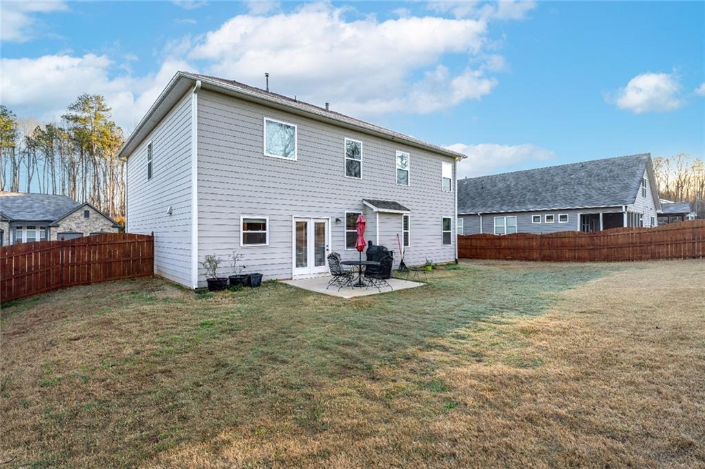 7545 Rambling Vale Dawsonville, GA 30534 - Photo 36 of 46 a view of a house with a yard