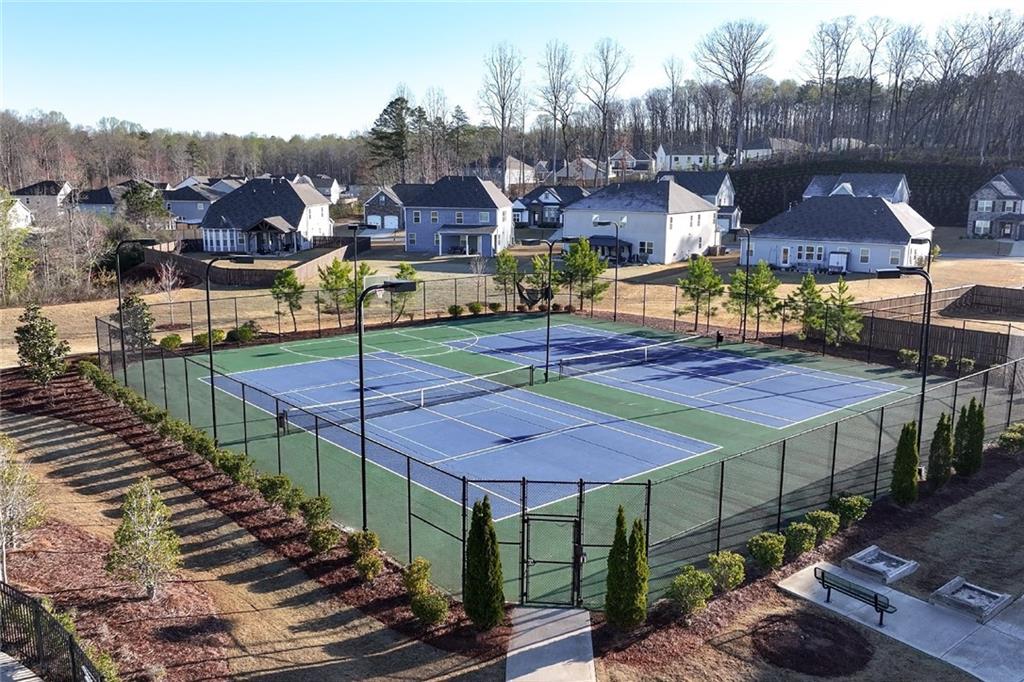 7545 Rambling Vale Dawsonville, GA 30534 - Photo 44 of 46 a view of a patio with table and chairs under an umbrella