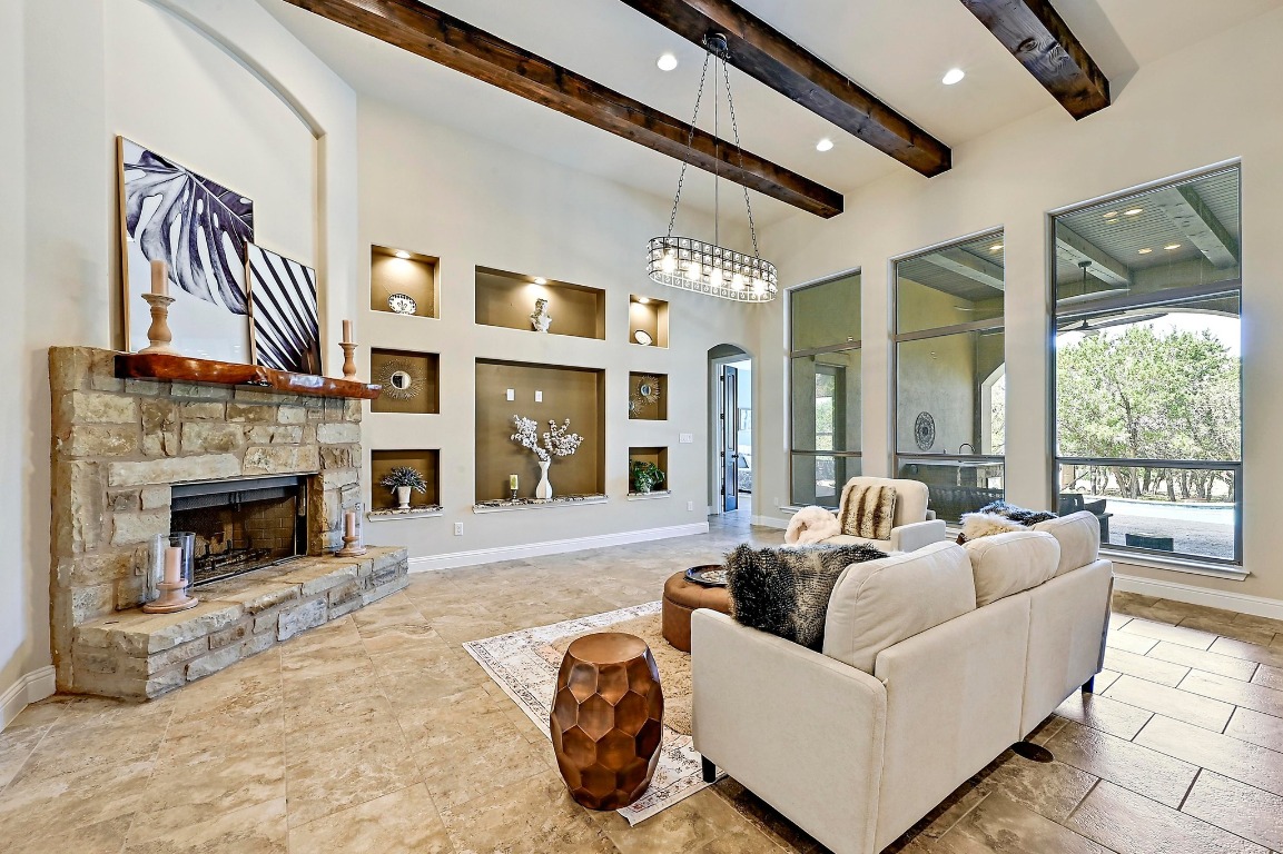 221 Tower Road Georgetown, TX 78628 - Photo 1 of 40 a living room with furniture large window and a fireplace