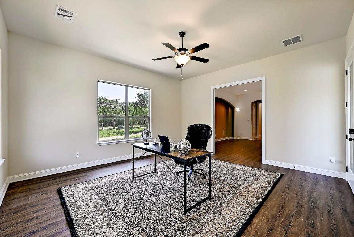 221 Tower Road Georgetown, TX 78628 - Photo 13 of 40 a workspace with wooden floor