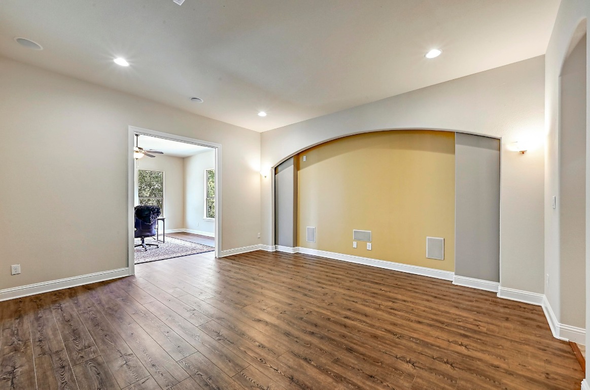 221 Tower Road Georgetown, TX 78628 - Photo 15 of 40 an empty room with wooden floor and door