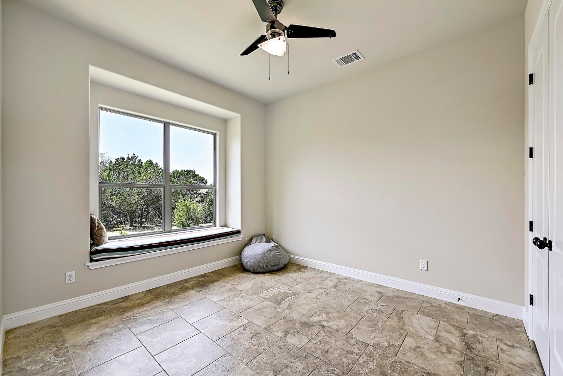 221 Tower Road Georgetown, TX 78628 - Photo 20 of 40 a view of room with window and ceiling fan