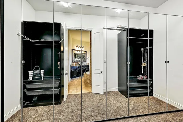 a kitchen with a refrigerator and a fireplace