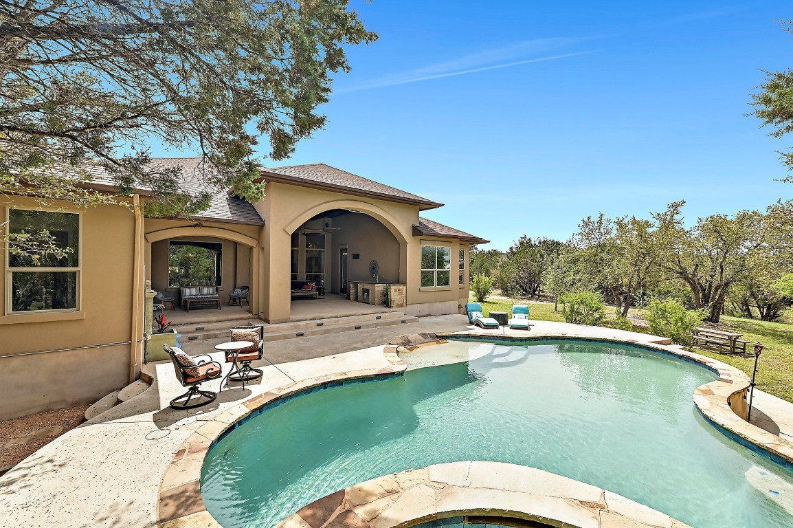 221 Tower Road Georgetown, TX 78628 - Photo 30 of 40 a view of a house with swimming pool and sitting area