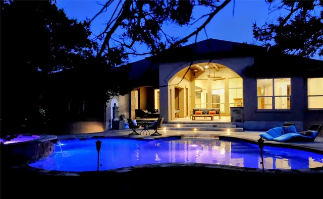 a view of swimming pool with outdoor seating