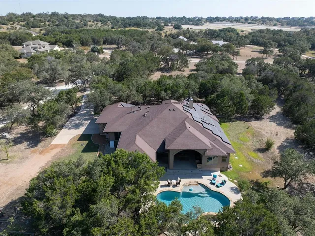 an aerial view of house with yard