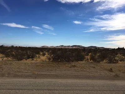 a view of mountain with sunset view