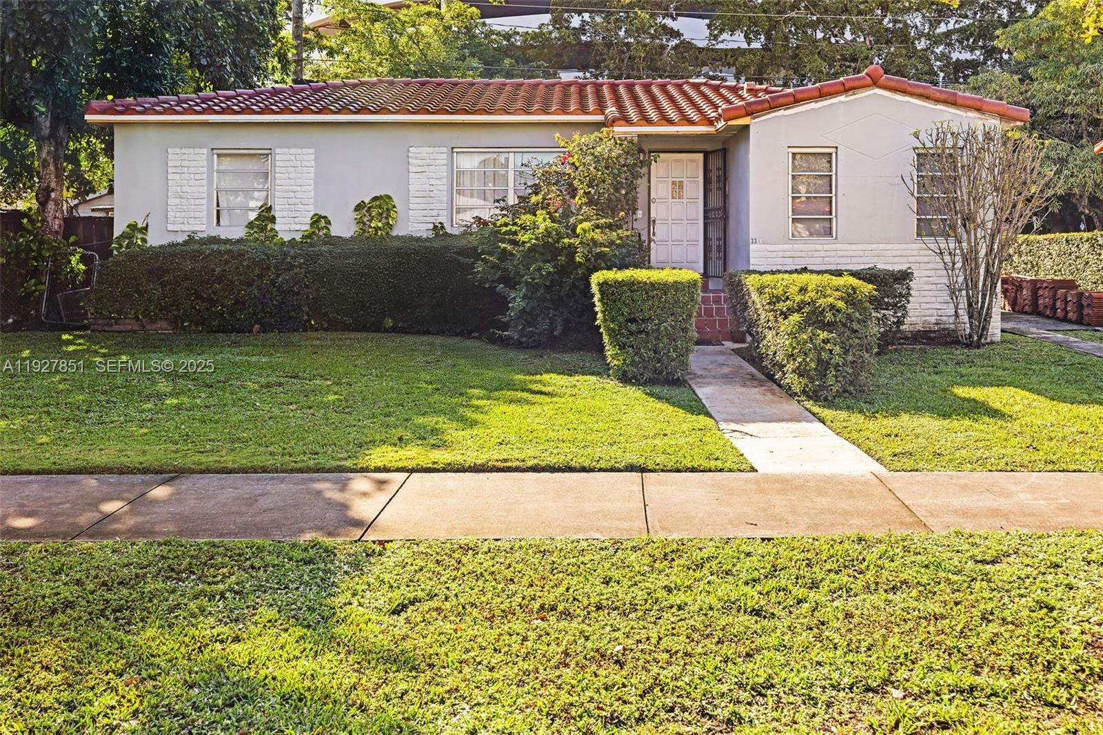 3310 Southwest 21st Street Miami, FL 33145 - Photo 1 of 20 a front view of a house with garden