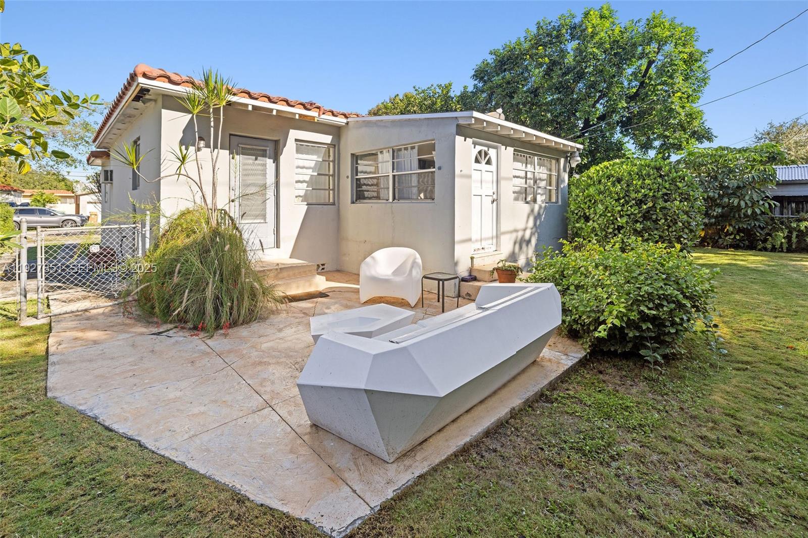 3310 Southwest 21st Street Miami, FL 33145 - Photo 18 of 20 a front view of a house with garden