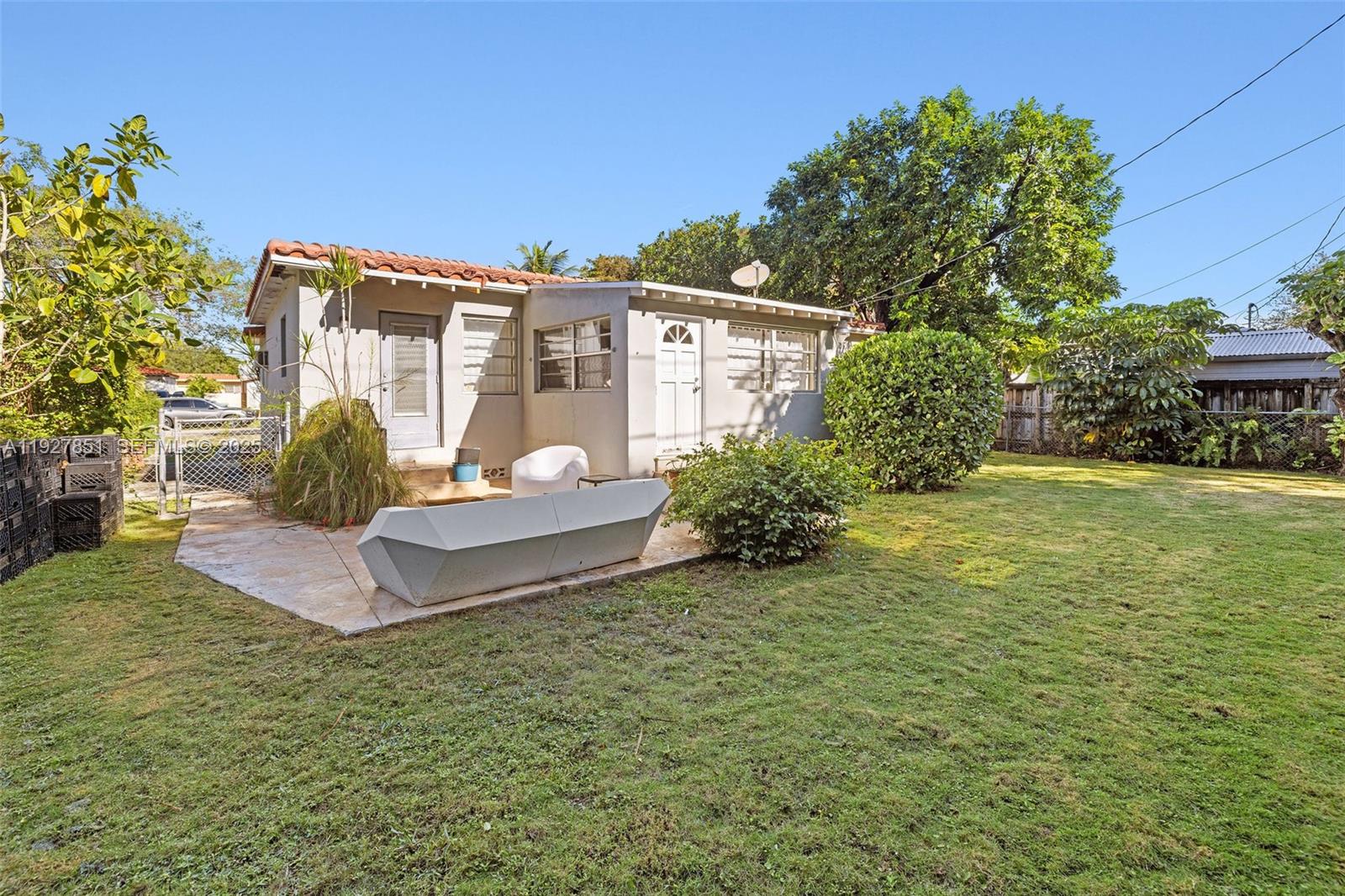 3310 Southwest 21st Street Miami, FL 33145 - Photo 19 of 20 a front view of a house with a yard
