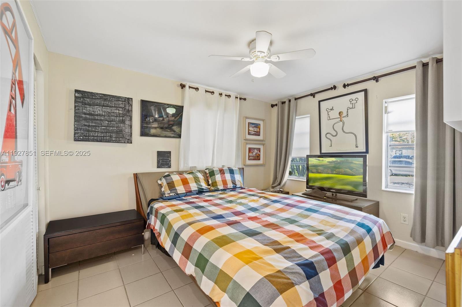 3310 Southwest 21st Street Miami, FL 33145 - Photo 7 of 20 a bedroom with a bed and a chandelier