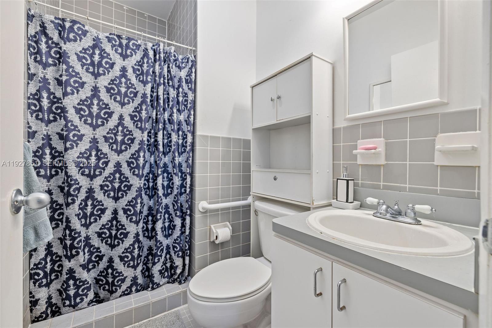 3310 Southwest 21st Street Miami, FL 33145 - Photo 9 of 20 a bathroom with a sink toilet and shower