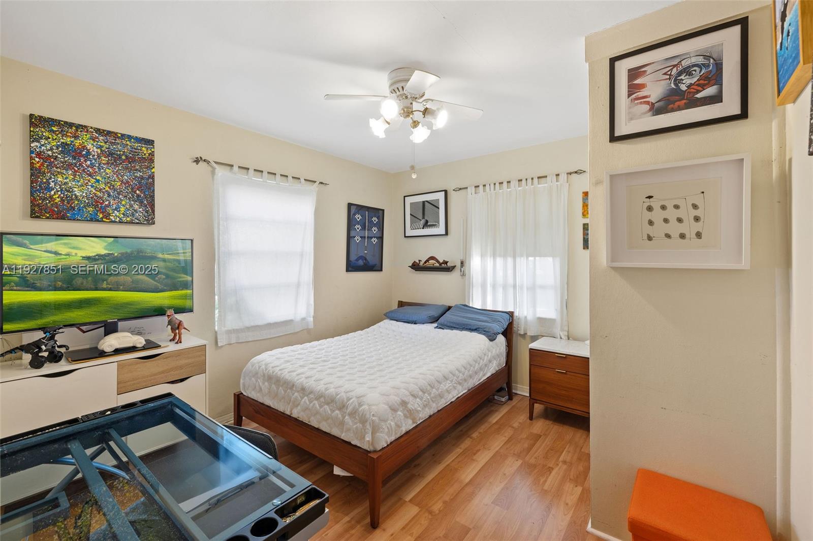 3310 Southwest 21st Street Miami, FL 33145 - Photo 10 of 20 a bedroom with a bed window and a flat screen tv