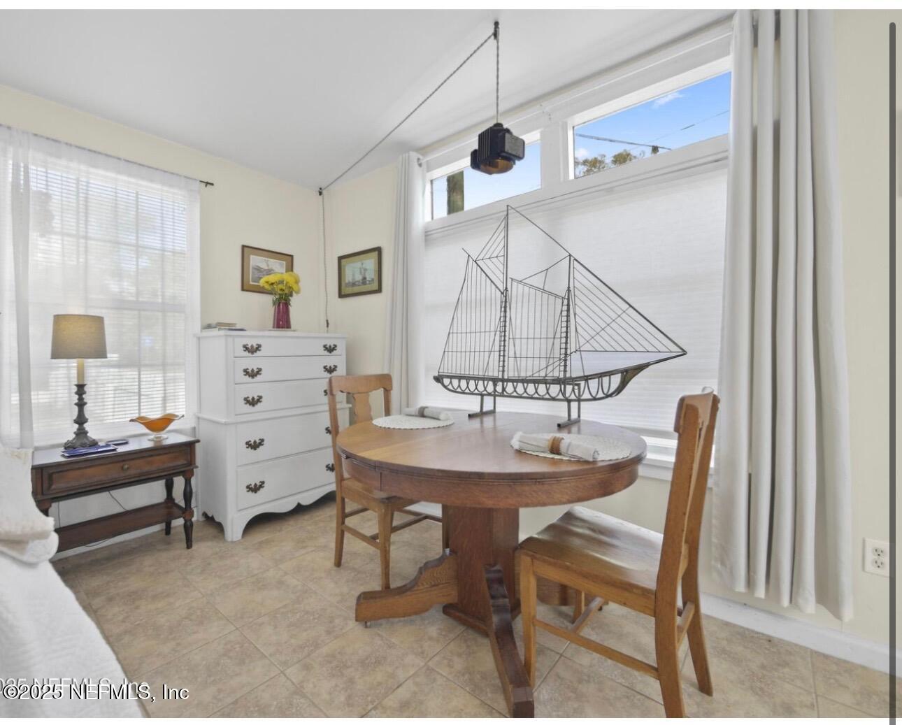 509 Live Oak Street, Unit 1 St. Augustine, FL 32084 - Photo 5 of 9 a view of a livingroom with furniture and a window