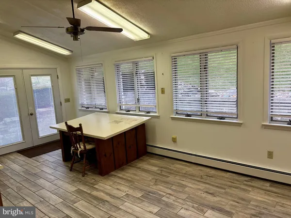 a room with a table and chairs