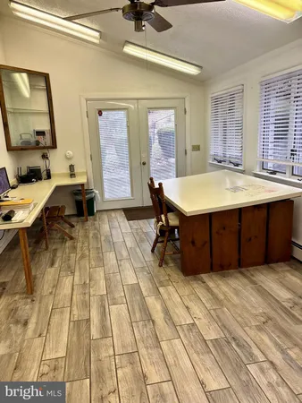 a view of a dining room with furniture and windows