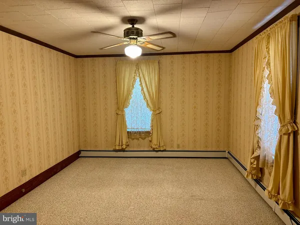 a view of a room with tiles and a window