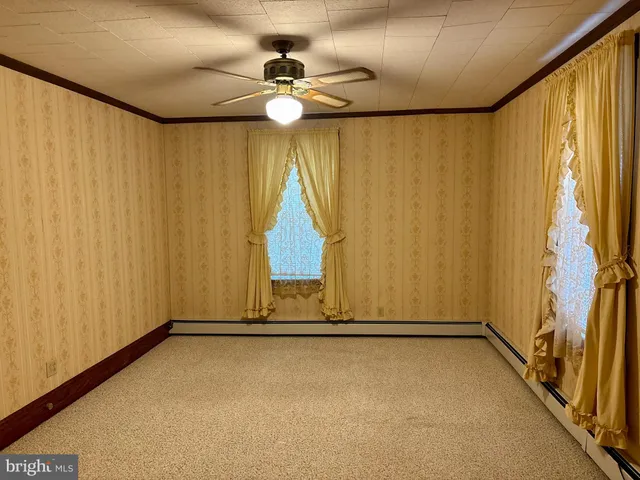 a view of a room with tiles and a window