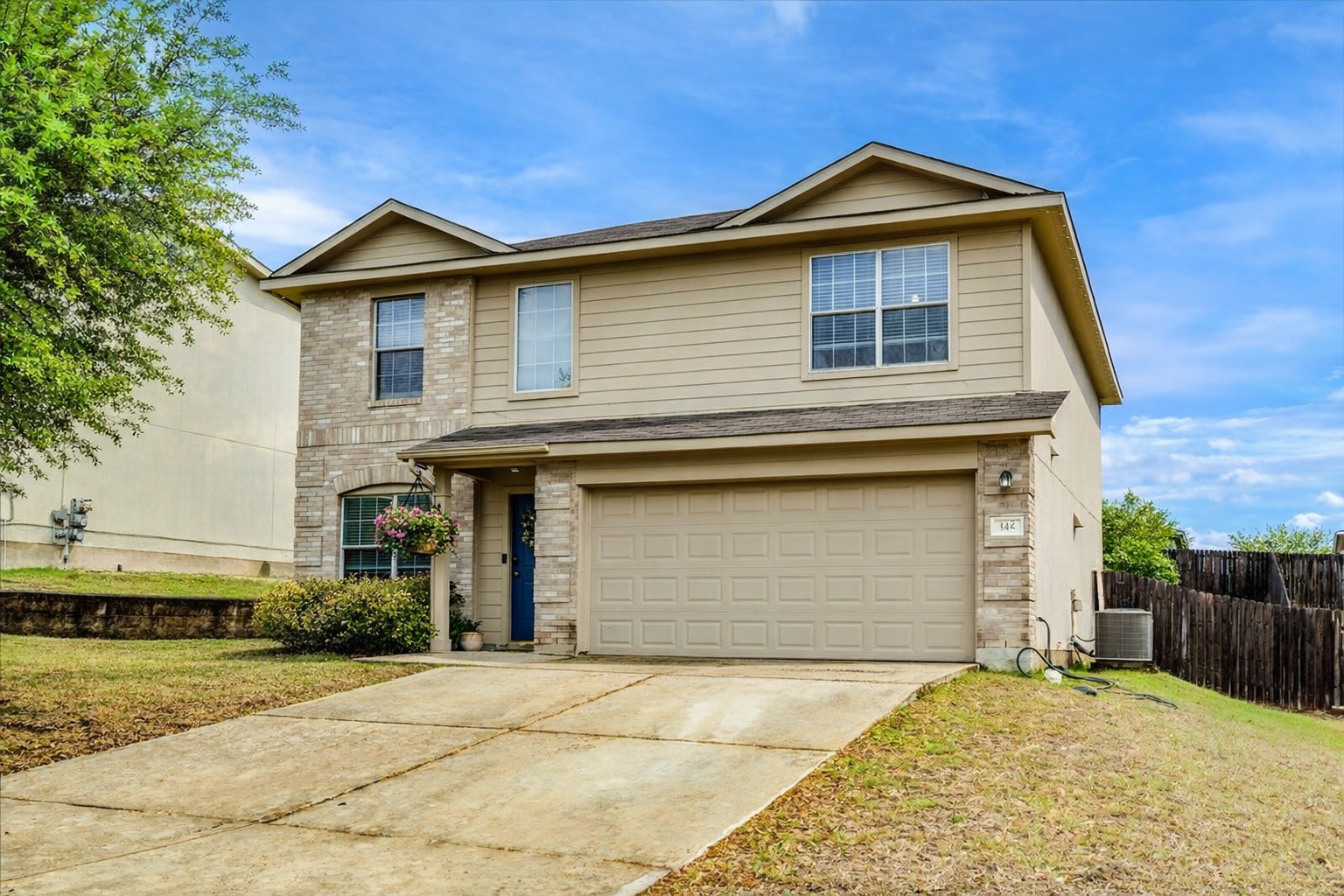148 Buttercup Way Kyle, TX 78640 - Photo 2 of 30 a front view of a house with a yard