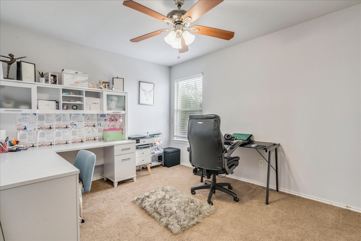 148 Buttercup Way Kyle, TX 78640 - Photo 21 of 30 a view of a workspace with furniture