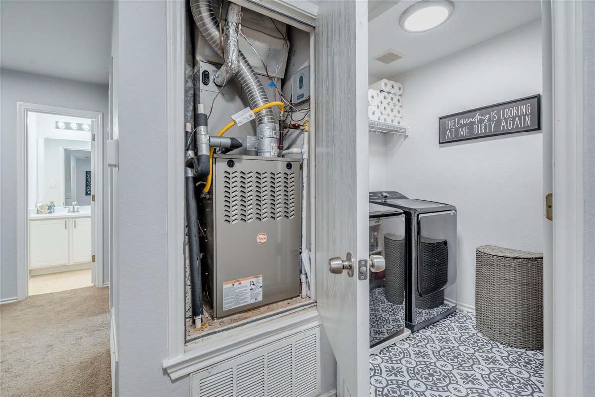 148 Buttercup Way Kyle, TX 78640 - Photo 25 of 30 a view of a hallway with wooden floor and a livingroom