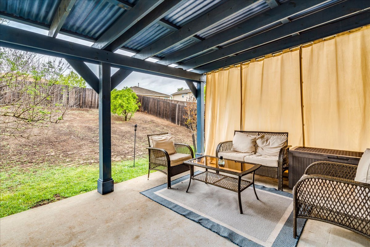 148 Buttercup Way Kyle, TX 78640 - Photo 26 of 30 a building outdoor space with seating