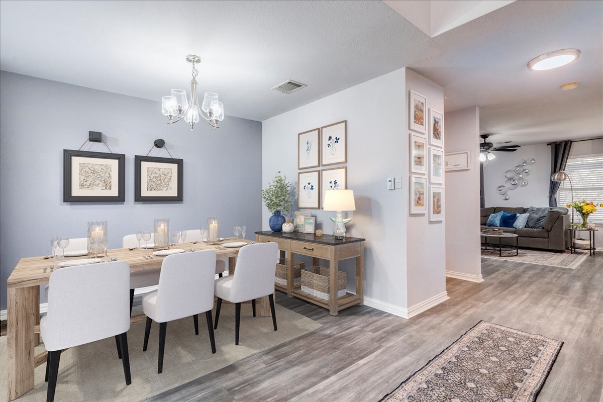 148 Buttercup Way Kyle, TX 78640 - Photo 4 of 30 a view of a dining room with furniture and wooden floor